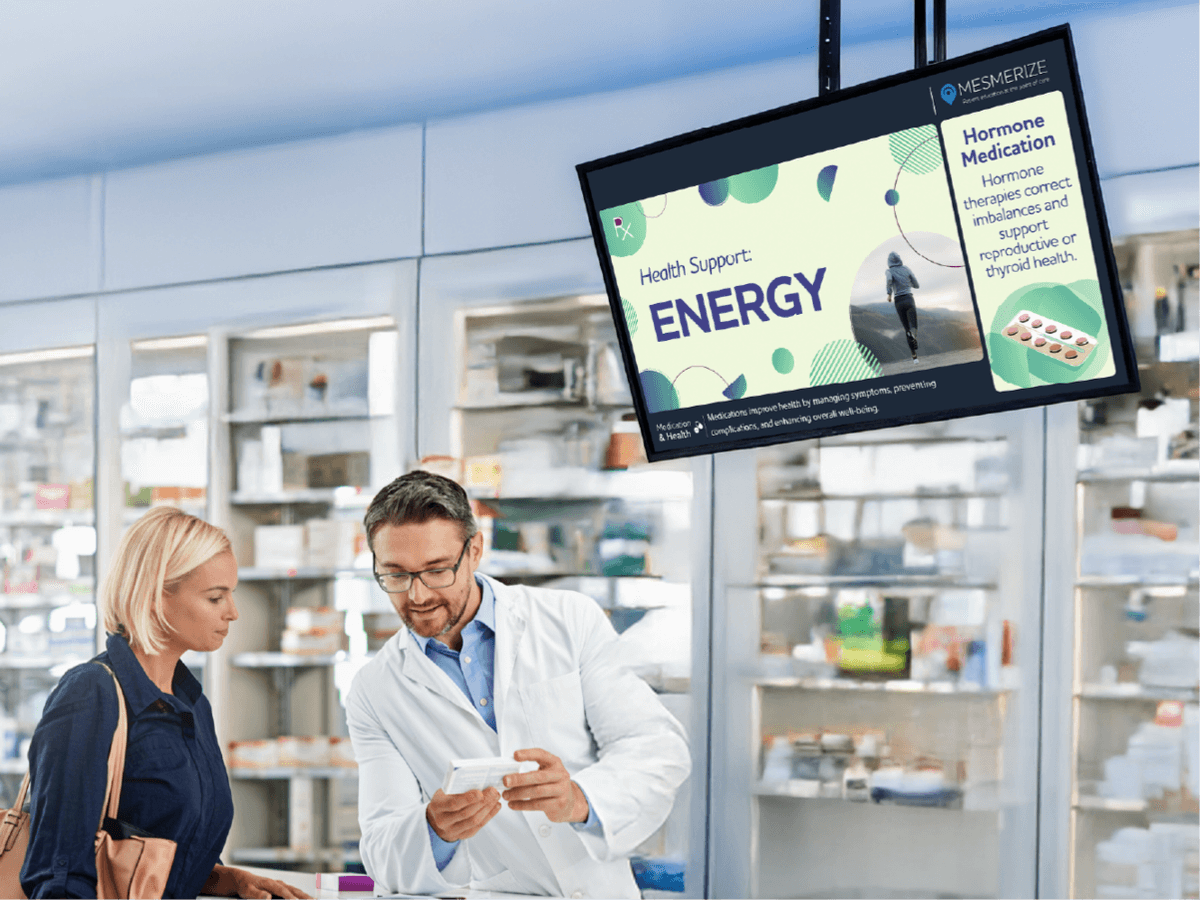 Doctor speaking with patient as they look at a digital screen on the wall