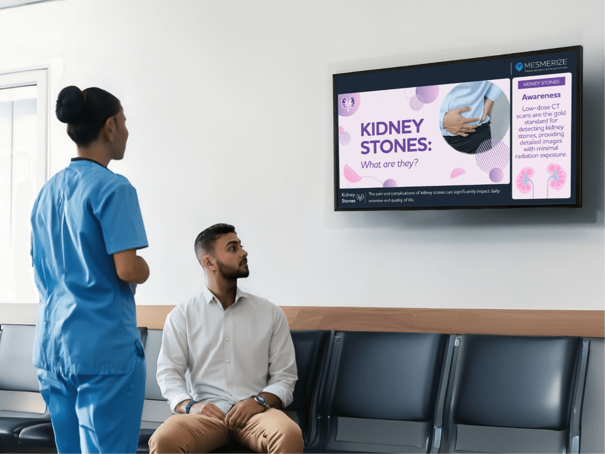 Doctor speaking with patient as they look at a digital screen on the wall