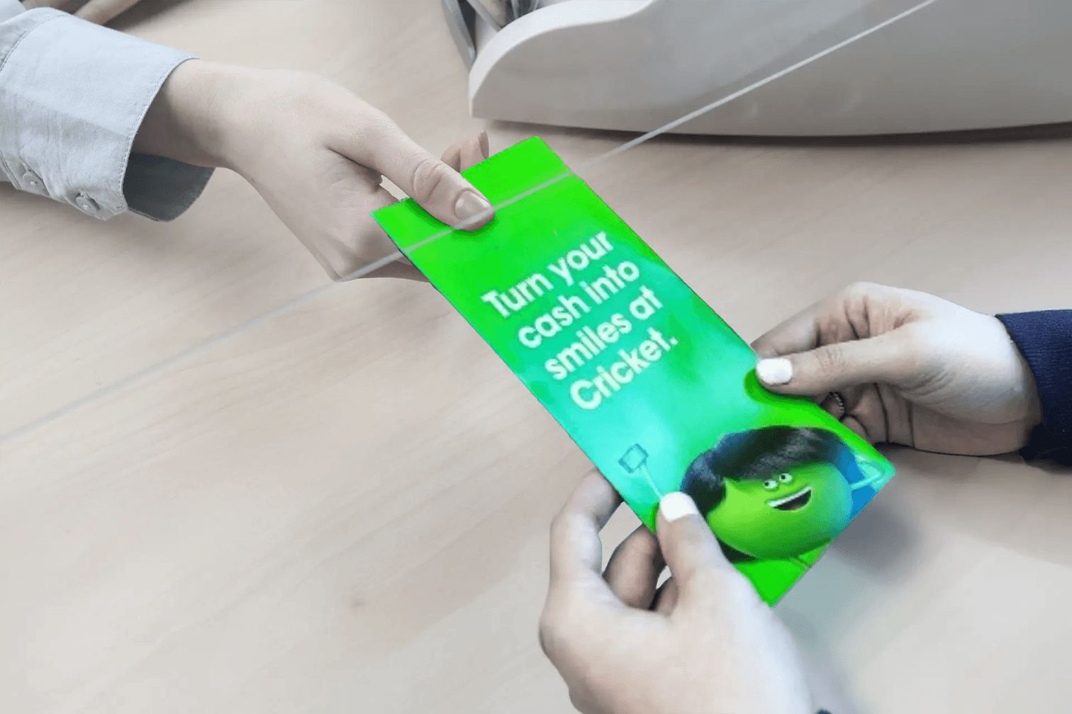 Doctor handing a patient a cash jacket with an advertisement on it.