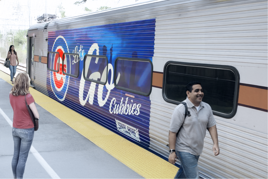 Commuters on subway platform with branded train advertisement