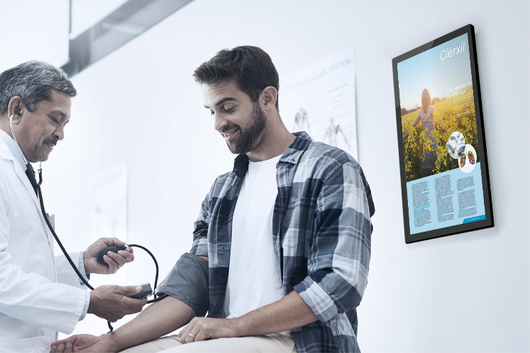Bus with healthcare advertisement parked at a transit stop