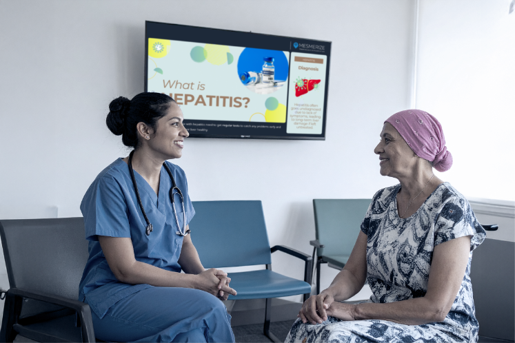 Pedestrians passing a bus with a commercial advertisement on its side